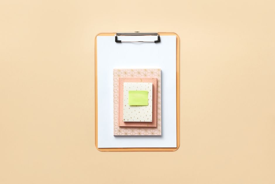 Clipboard and notes on a desk